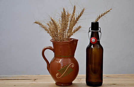 beer bottle, mug and ears of barleyの写真素材