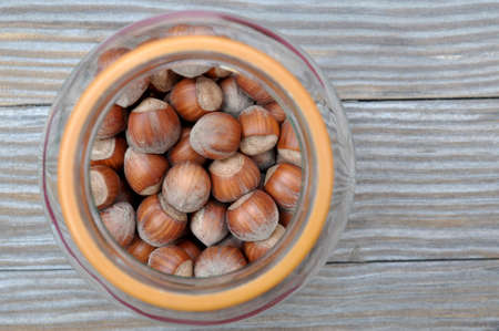 glass jar with hazelnuts