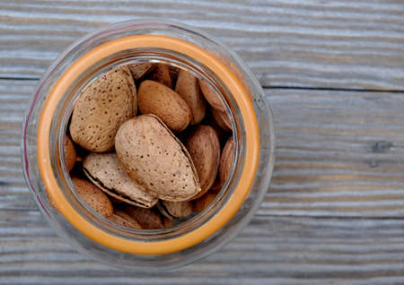glass jar with almondsの写真素材