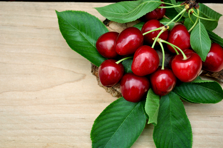 fresh cherries and green leavesの写真素材