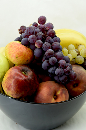 ripe fresh fruit in a bowlの写真素材