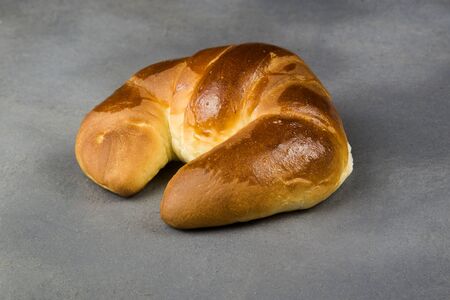 isolated croissant on grey background