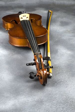 old fiddle on the floorの写真素材