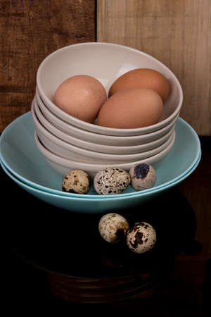 quails eggs and chicken eggsの写真素材
