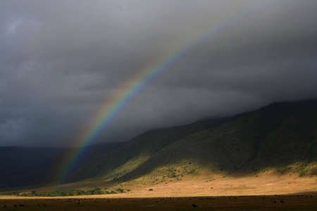  rainbow at ngorongoro crater in tanzania, africa, at early morningの写真素材