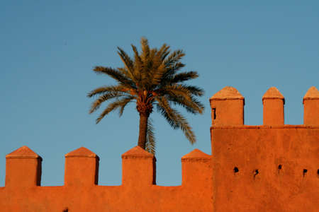 Part of city big wall in Marrakech, Morocco. Sunsetの写真素材