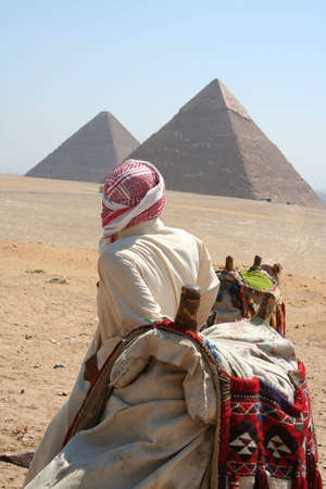 Bedouin and Camel in front of famous Pyramid og Giza (Gizeh)