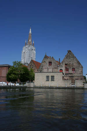 typical scenery at a canal of Brugge, Belgium の写真素材