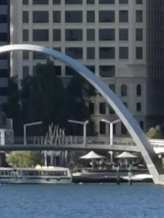 Reflection of a bridge over the river in the city, blurred backgroundの写真素材