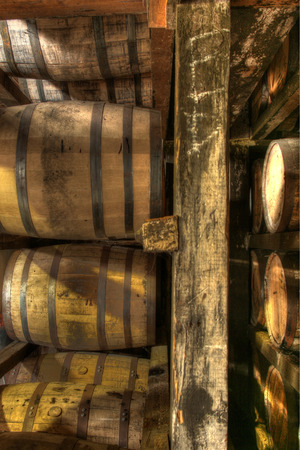 Rows of bourbon aging barrels stacked for time