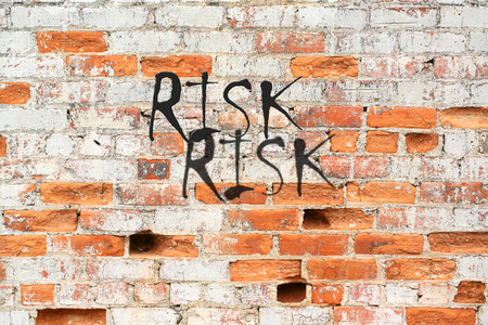 Risk message and concept on decaying brick wallの写真素材