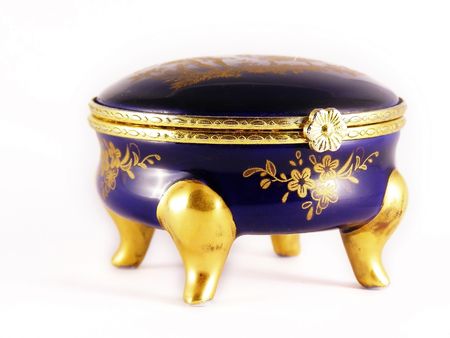 Old gold-blue jewelry box on whiteの写真素材