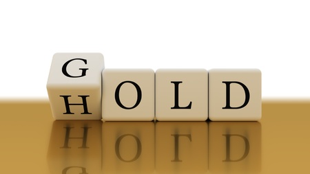 Words gold and hold in white cubes on gold table. 3d rendering creative conceptの写真素材