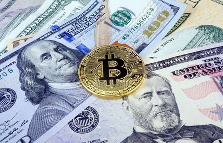 Coin Bitcoin on the US dollars backgroundの写真素材