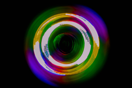 Colorful light neon circle in dark black backgroundの写真素材