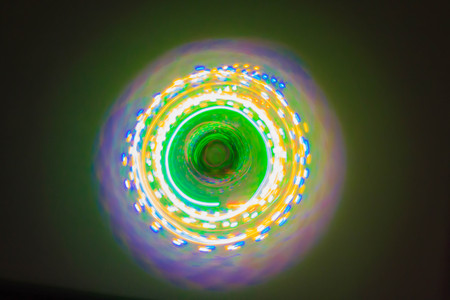 Colorful light neon circle in dark black backgroundの写真素材