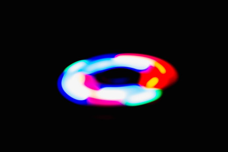 Colourful sphere light in dark backgroundの写真素材