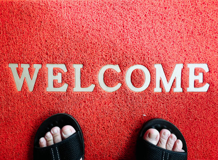 Red mats with welcome word and footの写真素材