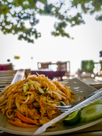 Pad Thai on table at the beachの写真素材