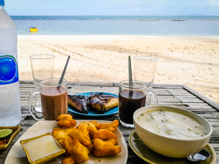Breakfast on the morning beach tableの写真素材