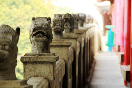 Stone carving on the bridge in a temple in Thailand, Asia.の写真素材