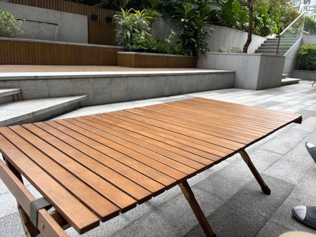 Wooden table and chair in the public park.の写真素材