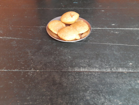 Traditional snacks and sweets of India.  It is made by mixing rice flour and jaggery and frying it...