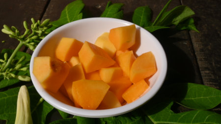 Ripe papaya sliced on bowl. Fresh yellow papaya. It is complete food for humans. Many vitamins are...