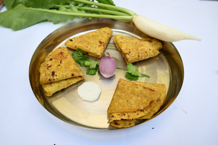 Mooli paratha or Radish flatbread. Healthy Indian Mooli paratha. Daikon flatbread. It is a popular...