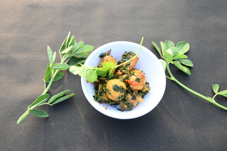 Aloo Methi or Fenugreek potato vegetable. It is made with fresh fenugreek leaves and potatoes....