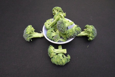 Broccoli on black background. Its other name Brassica oleracea var italica. This is an edible green plant in the cabbage family. It is a particularly rich source of vitamin C and Kの写真素材