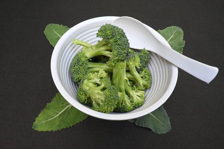 Broccoli on black background. Its other name Brassica oleracea var italica. This is an edible green plant in the cabbage family. It is a particularly rich source of vitamin C and Kの写真素材