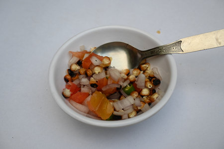 Grilled corn Chaat. Indian style corn salad that's sweet, spicy and tangy. It is mixed with chaat...