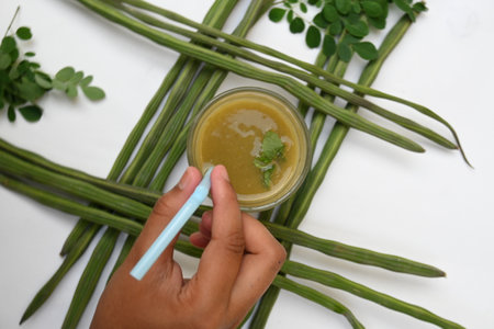 Moringa oleifera or drumstick pods soup. Moringa oleifera other names moringa, horseradish, andÂ ben oilÂ tree andÂ benzolive. Healthy and tasty soup. Healthy drinks.の写真素材