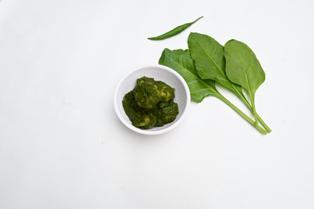 Indian Spinach and Potato Curry. Indian vegetable curry with spinach and potato. A dry dish made from fried potatoes and spinach in Indian style.の写真素材