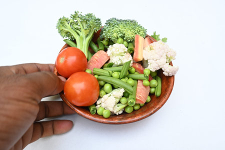 Vibrant medley of fresh vegetables. Features broccoli, cauliflower, tomatoes, Carrot, green beans,...