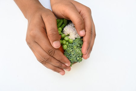 Vibrant medley of fresh vegetables. Features broccoli, cauliflower, tomatoes, Carrot, green beans, and peas. colourful vegetables of spring time, Its good for health.の写真素材