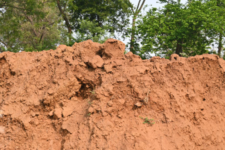 Pile of soil. The soil has been dug out and kept to make Clay brick. Red soil in Natural...