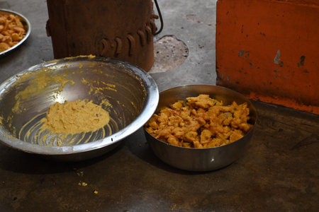 Onion pakora frying in iron pan. This is a popular street food in Indian subcontinent. Onion which...