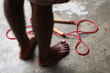 A man is Skipping. Jumping rope, also known as skipping, is a highly effective and accessible full-body workout with a wide range of benefits for your physical and mental health.の写真素材