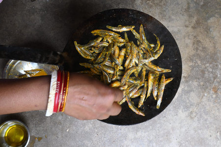 Small Snakehead or Channa orientalis Fish being fried in a pan. Its typically marinated with spices...
