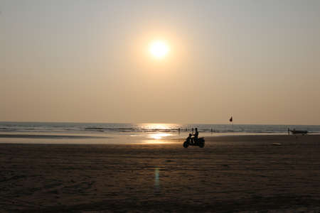 sunset on the Arabian sea on the beach Indiaの写真素材