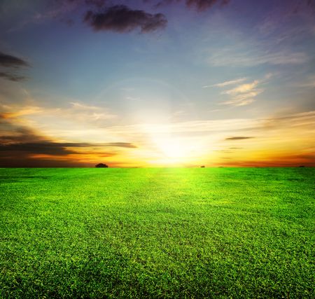 Green Field and Beautiful Sunsetの写真素材