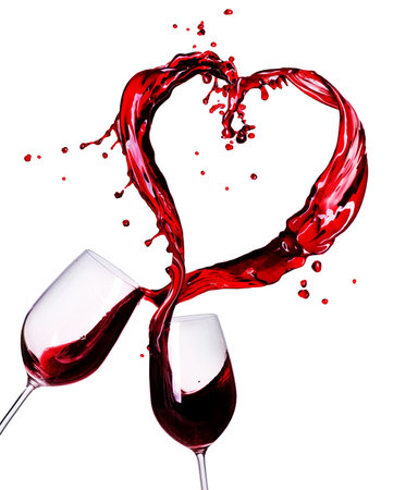 Two Glasses of Red Wine Abstract Heart Splashの写真素材