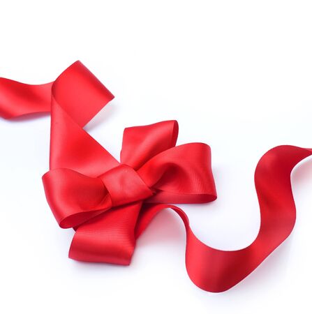 Red satin gift bow. Ribbon. Isolated on whiteの写真素材