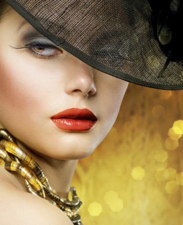 Beautiful Woman over luxury gold backgroundの写真素材