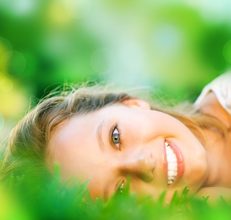 Spring Girl in Green Grass の写真素材