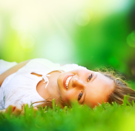 Spring Girl lying on the Field  Happiness の写真素材