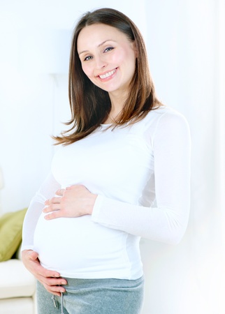 Pregnant Young Woman at home  Healthy Pregnancyの写真素材