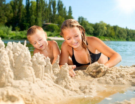 Happy kids Having Fun at the Beach in summer  River の写真素材